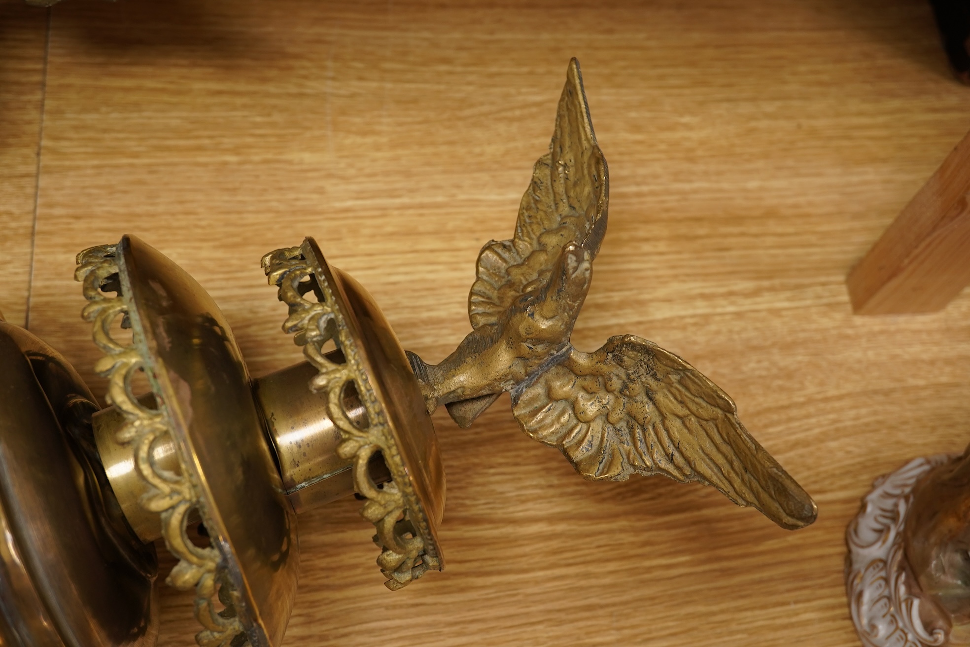 A pair of brass coaching lamps with eagle mounts, 75cm high